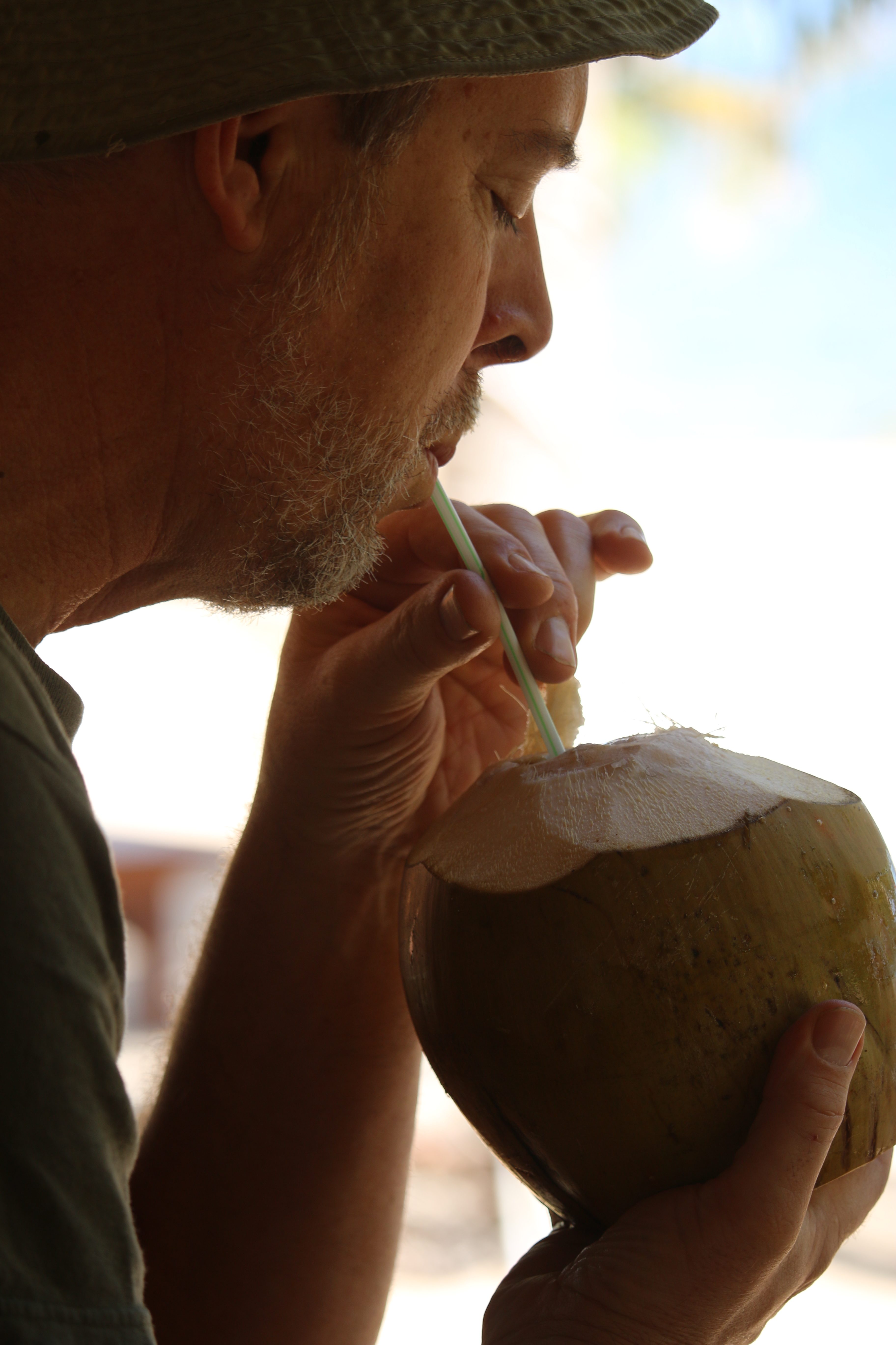 Andy, enjoying some rum-enhanced coconut water