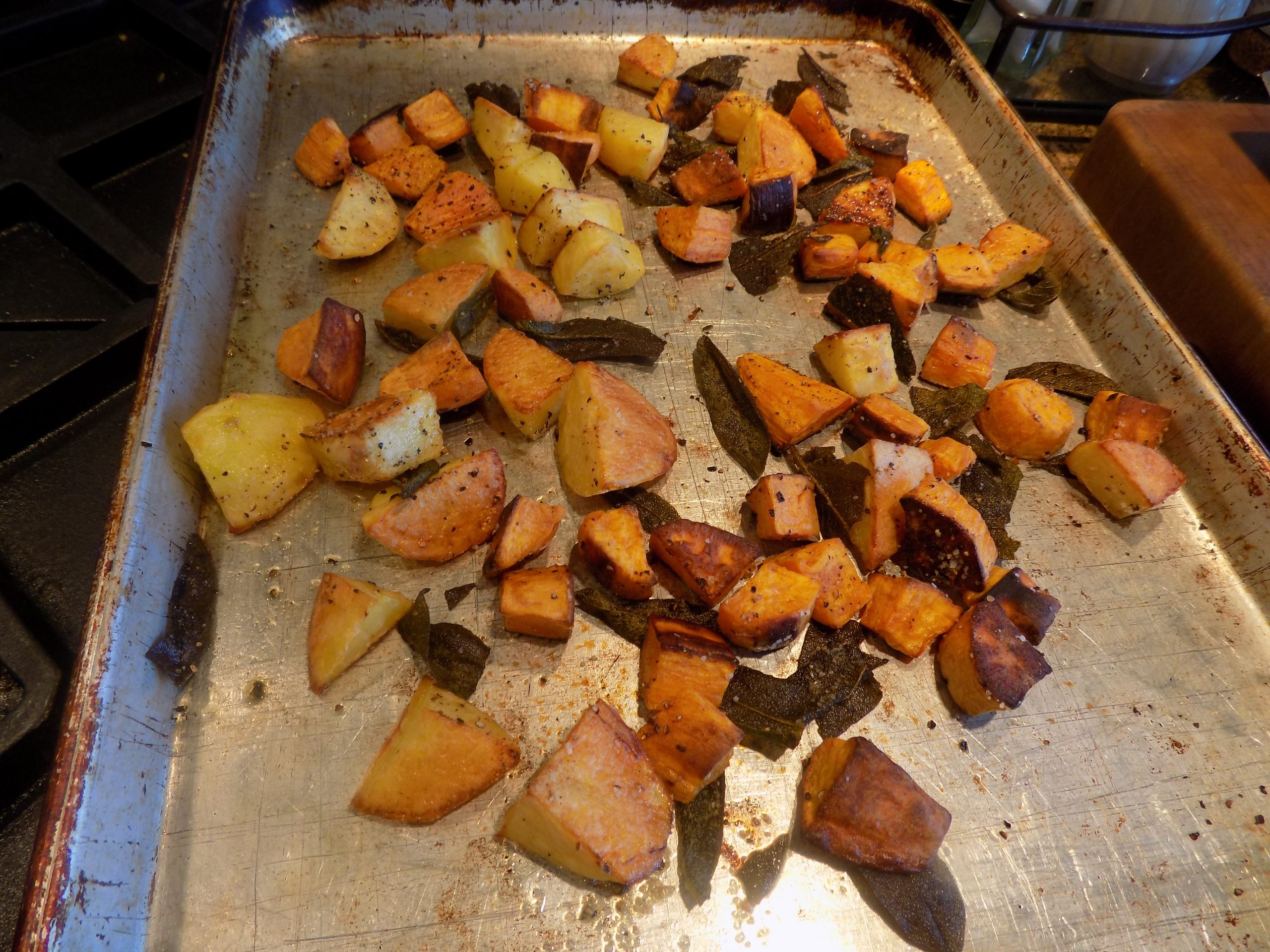 OVEN ROASTED YUKON GOLD AND SWEET POTATOES WITH FRESH SAGE LEAVES